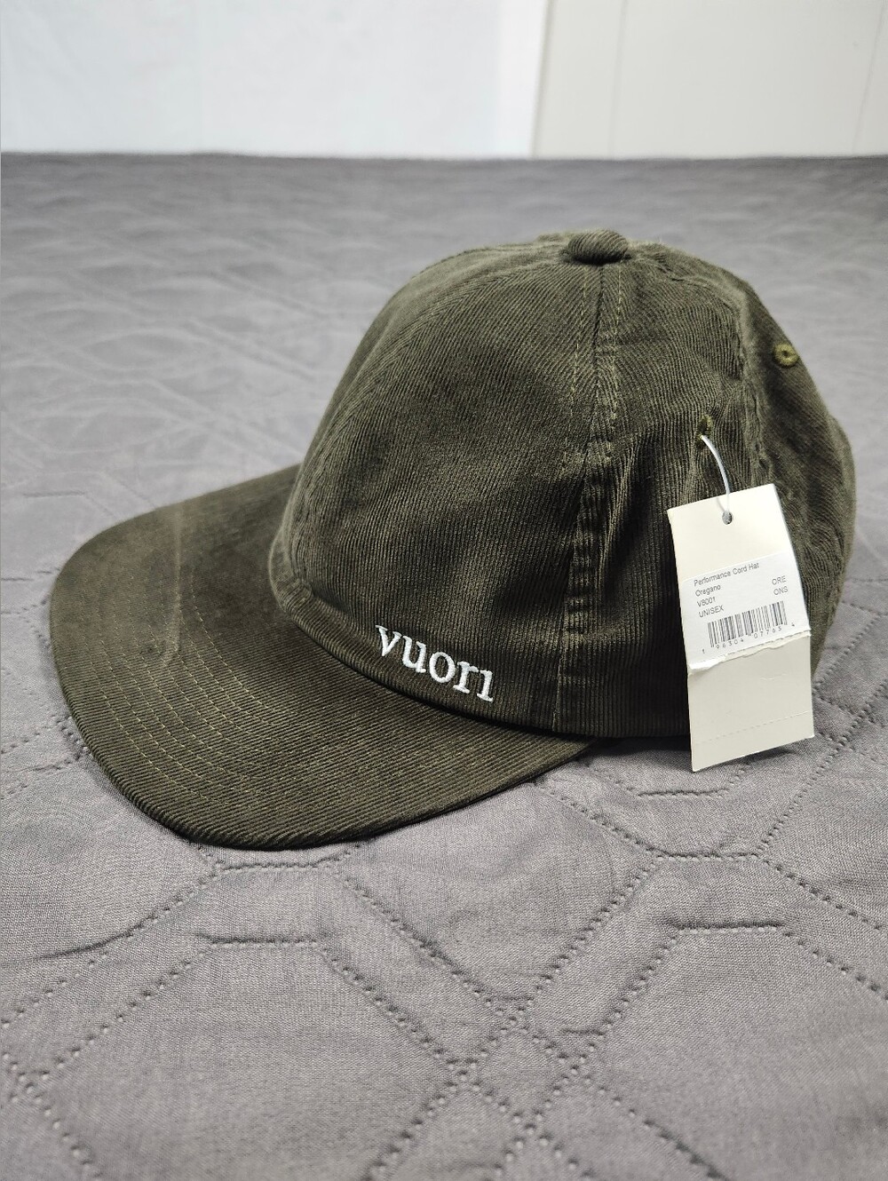 olive green Vuori Performance Cord unisex Hat in the Oregano color imperfection